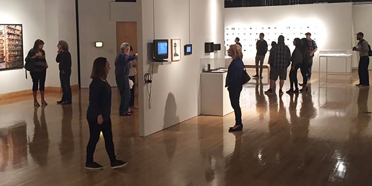 Photo of visitors at a reception in the Fine Arts Gallery